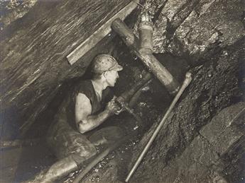 (MINING--GERMANY) An album titled "Im Pütt" with 14 handsome photographs of workers in a mine. 1953.